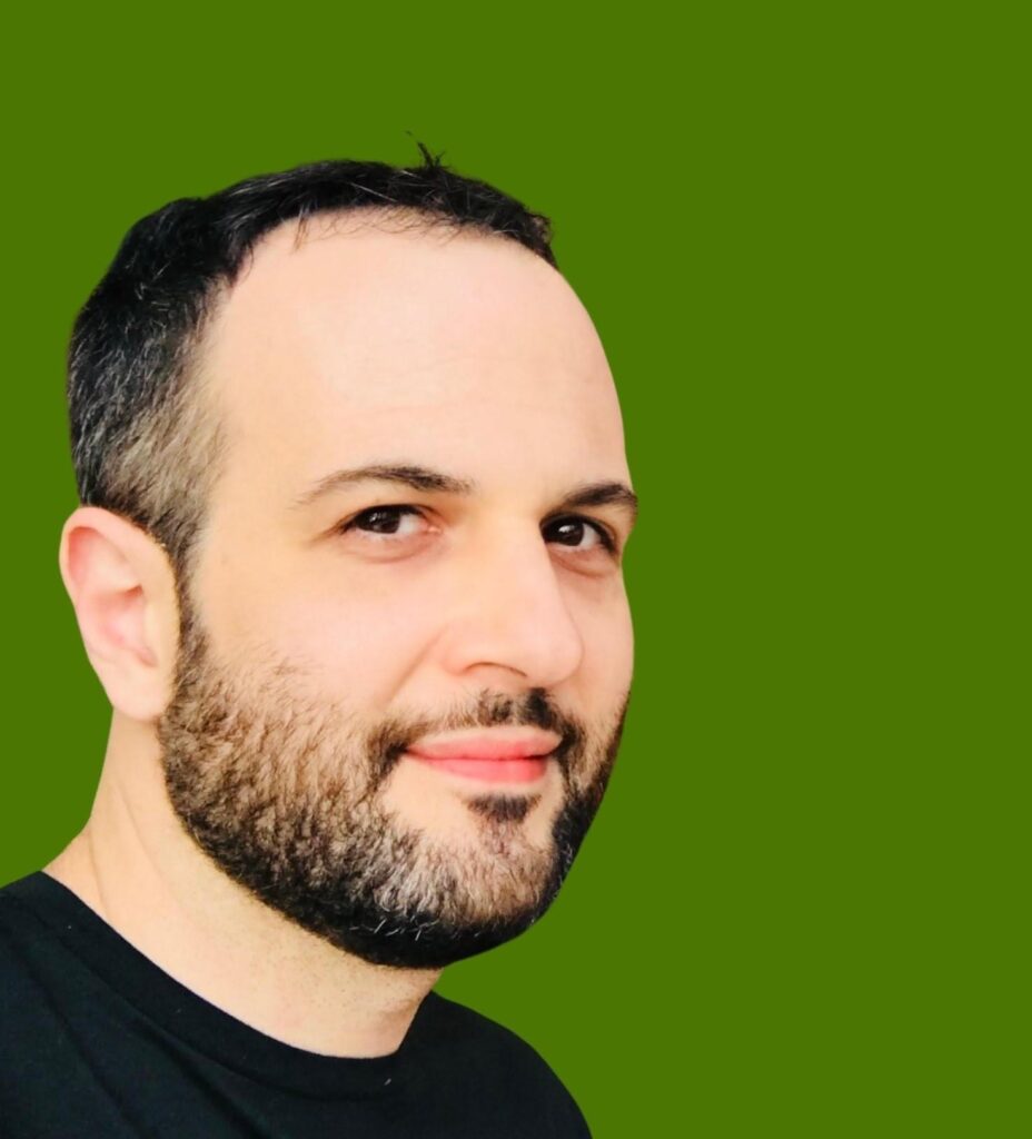 Man with short hair, green background